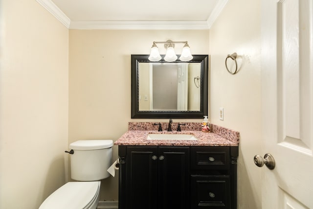 bathroom with toilet, crown molding, and vanity