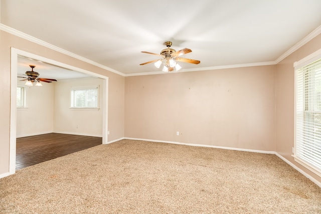 empty room featuring ornamental molding, hardwood / wood-style floors, and a healthy amount of sunlight