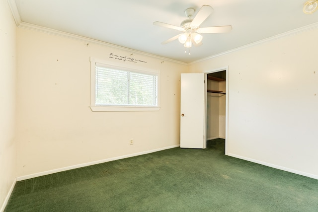 carpeted empty room featuring crown molding and ceiling fan