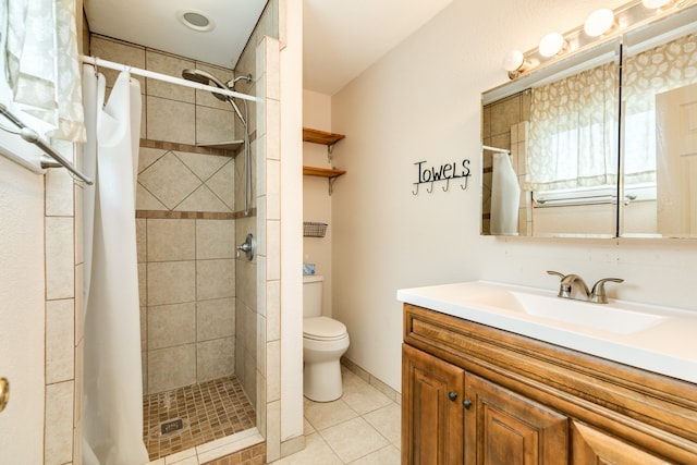 bathroom featuring vanity, walk in shower, toilet, and tile patterned floors