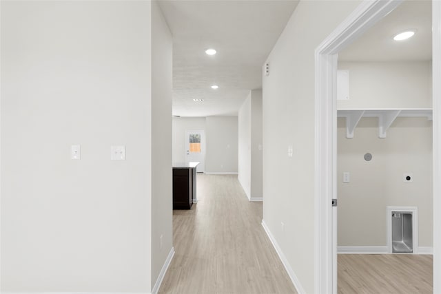 corridor featuring light hardwood / wood-style floors