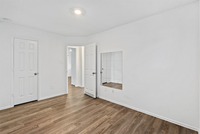 unfurnished bedroom featuring wood-type flooring