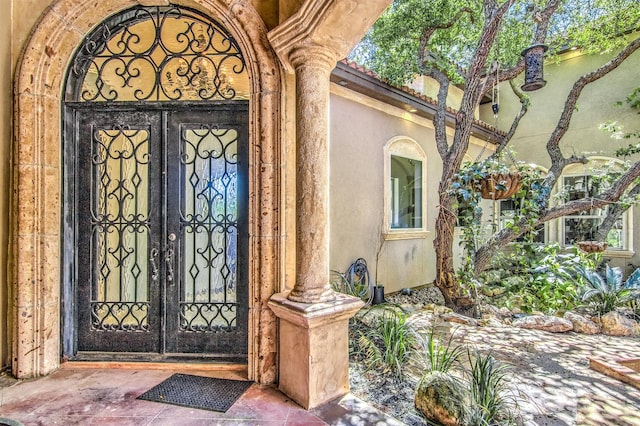 9469 Canyon Mist, Helotes, TX 78023 - property entrance with french doors and stucco siding