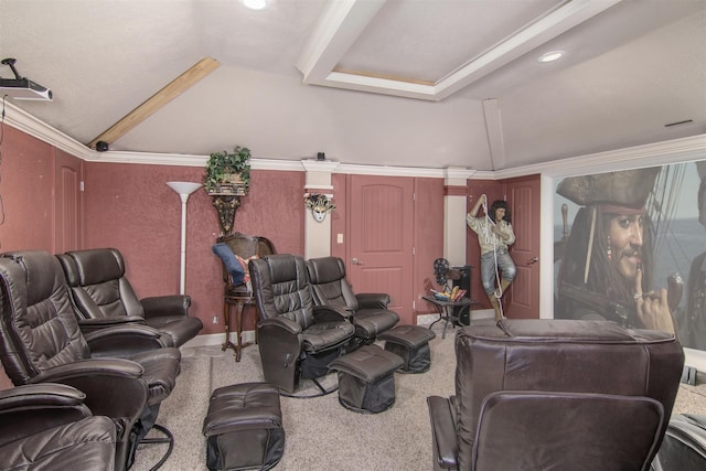 carpeted cinema featuring crown molding and vaulted ceiling