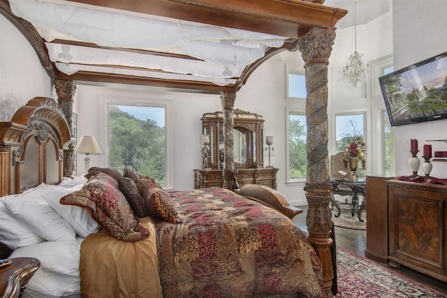 9469 Canyon Mist, Helotes, TX 78023 - bedroom featuring multiple windows and wood finished floors