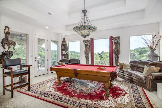 game room with light carpet, billiards, and a tray ceiling