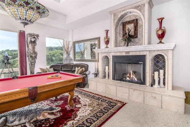 recreation room featuring billiards and a tile fireplace