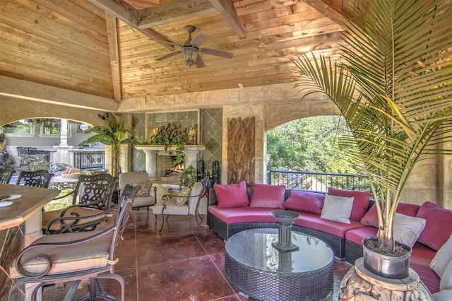 view of patio / terrace featuring area for grilling, an outdoor living space, and ceiling fan