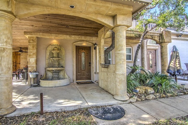 view of exterior entry with a garage