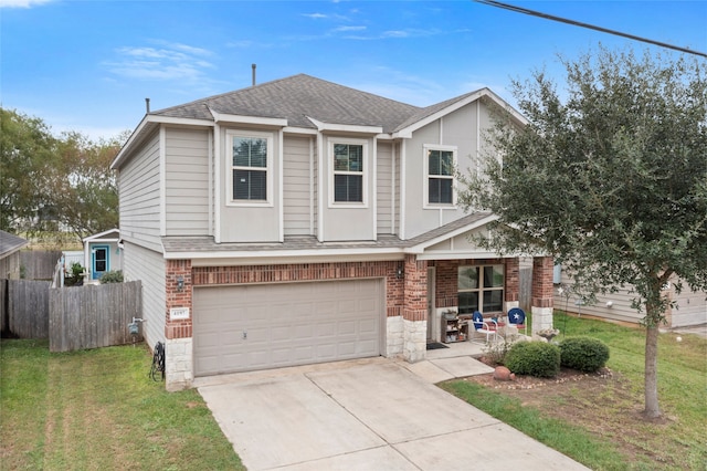 view of front of house with a garage and a front yard