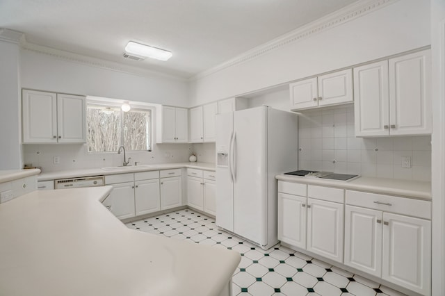 kitchen with decorative backsplash, ornamental molding, sink, white cabinets, and white appliances