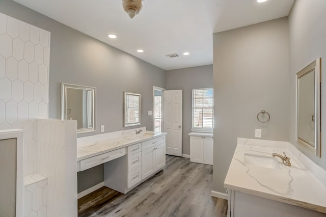 bathroom featuring vanity and hardwood / wood-style floors