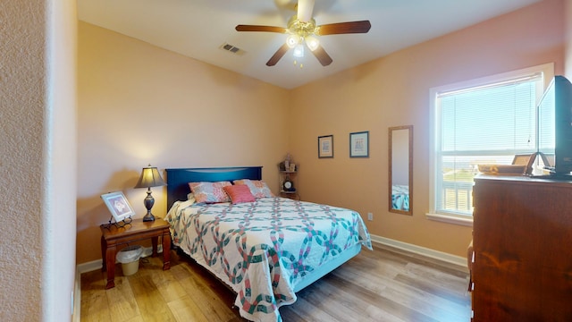 bedroom featuring ceiling fan and light wood-type flooring