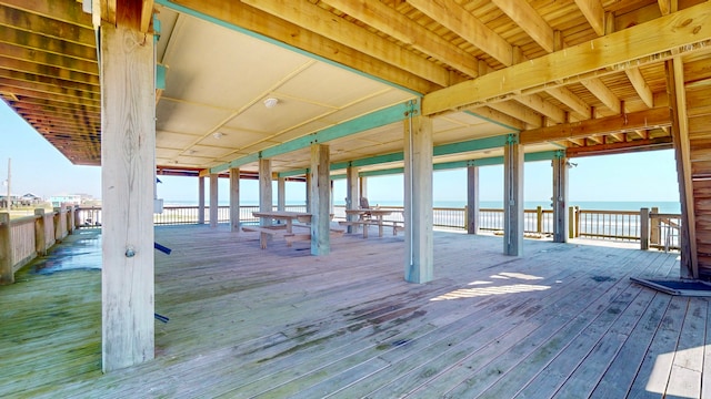 wooden terrace with a water view