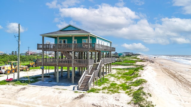 view of front facade with a water view and a view of the beach