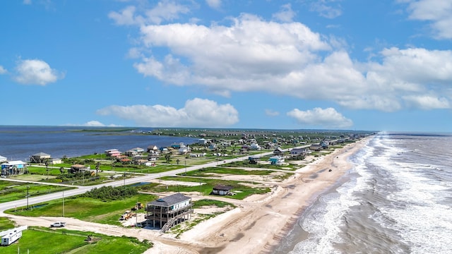 bird's eye view with a view of the beach and a water view