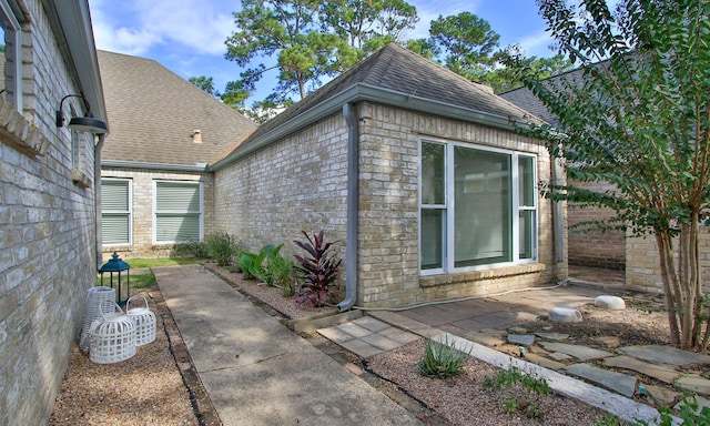 view of property exterior with a patio