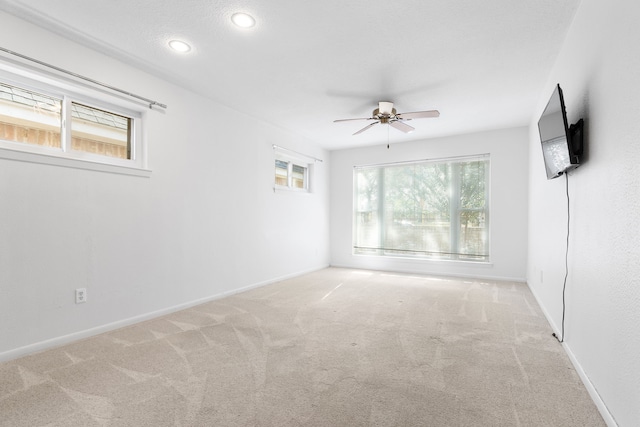 carpeted empty room with ceiling fan