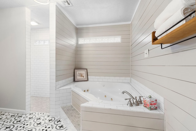 bathroom with shower with separate bathtub, ornamental molding, a textured ceiling, and wooden walls