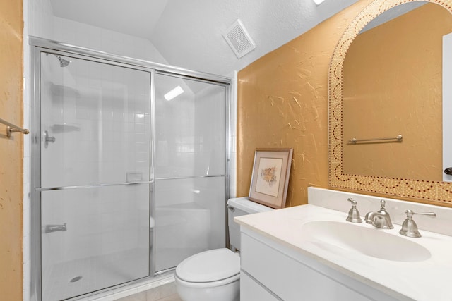 bathroom with lofted ceiling, toilet, a shower with door, and vanity