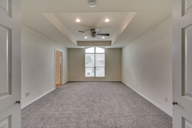 208 Cobblestone Cir, Red Oak, TX 75154 - unfurnished room with baseboards, light carpet, a ceiling fan, and a raised ceiling