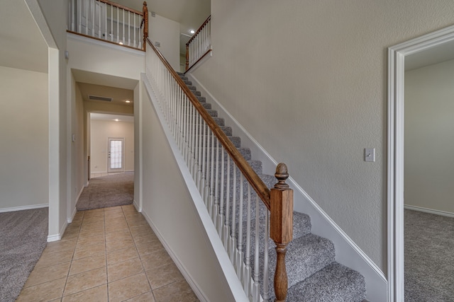 208 Cobblestone Cir, Red Oak, TX 75154 - staircase featuring tile patterned flooring, baseboards, visible vents, and carpet floors