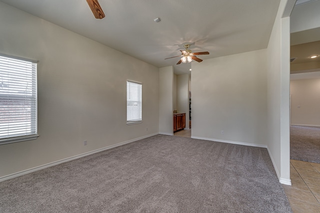 208 Cobblestone Cir, Red Oak, TX 75154 - empty room with a ceiling fan, baseboards, a wealth of natural light, and light colored carpet