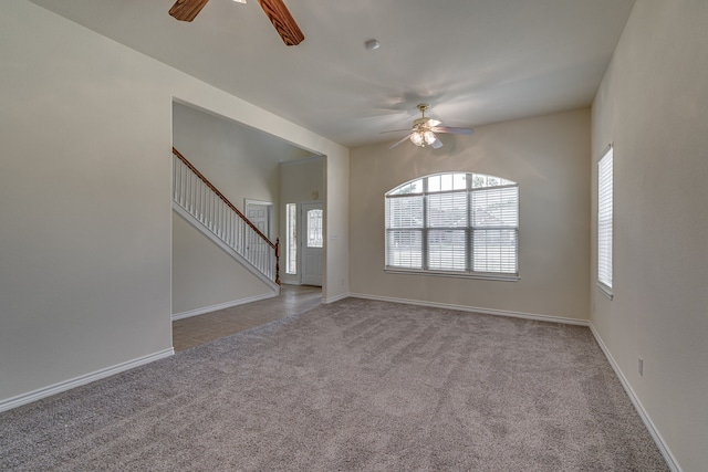 208 Cobblestone Cir, Red Oak, TX 75154 - unfurnished living room featuring baseboards, carpet floors, stairs, and ceiling fan