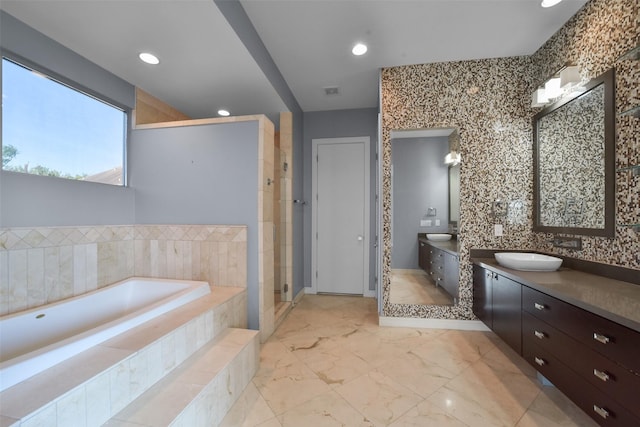 full bath featuring a stall shower, a bath, vanity, marble finish floor, and recessed lighting
