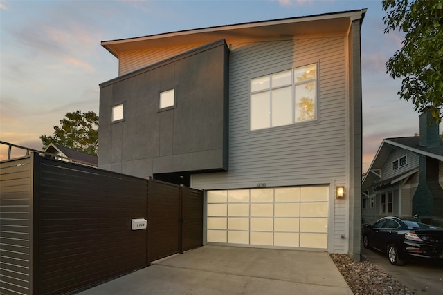 property exterior at dusk with a garage