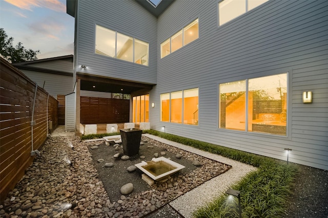 back of property with fence