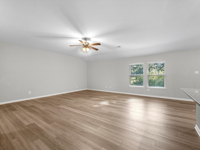 unfurnished room with ceiling fan and light hardwood / wood-style flooring