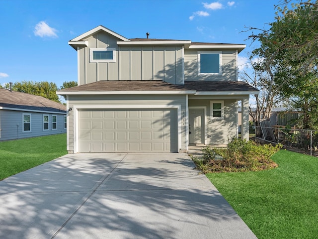 view of front of property with a front lawn and a garage