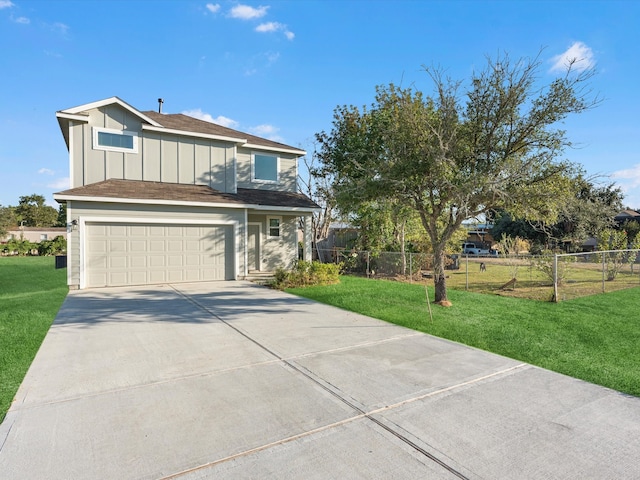 view of front of house with a front yard and a garage