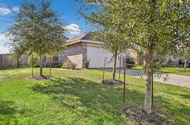 view of yard featuring a garage