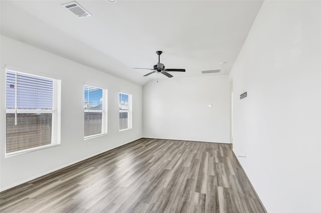 unfurnished room with ceiling fan and hardwood / wood-style floors