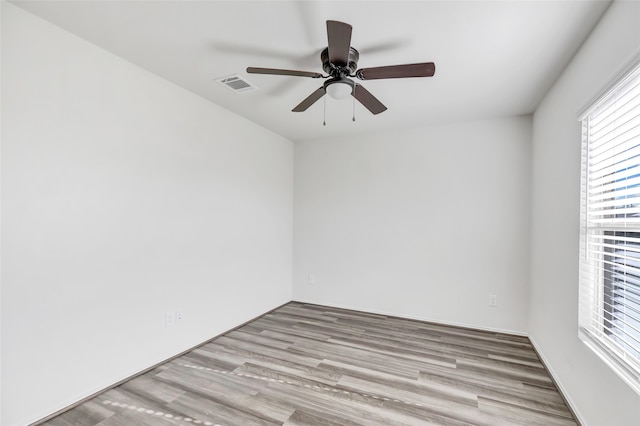 unfurnished room with ceiling fan and light hardwood / wood-style flooring