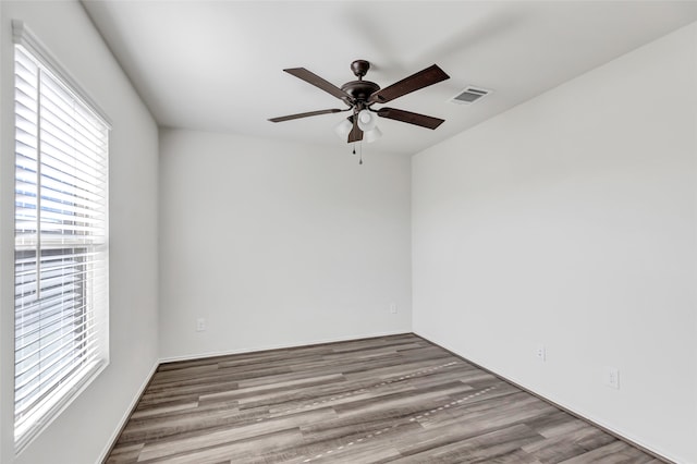 spare room featuring ceiling fan and hardwood / wood-style flooring