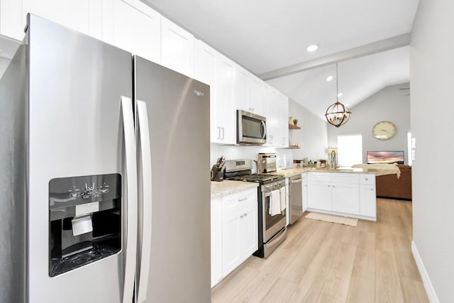 kitchen with stainless steel appliances, light wood-type flooring, white cabinetry, vaulted ceiling, and a peninsula