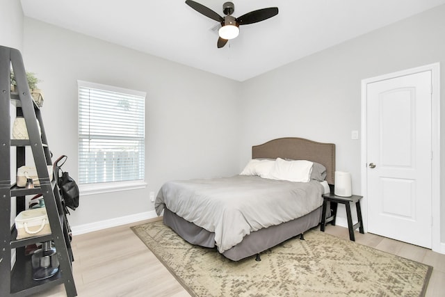 bedroom featuring ceiling fan and hardwood / wood-style floors