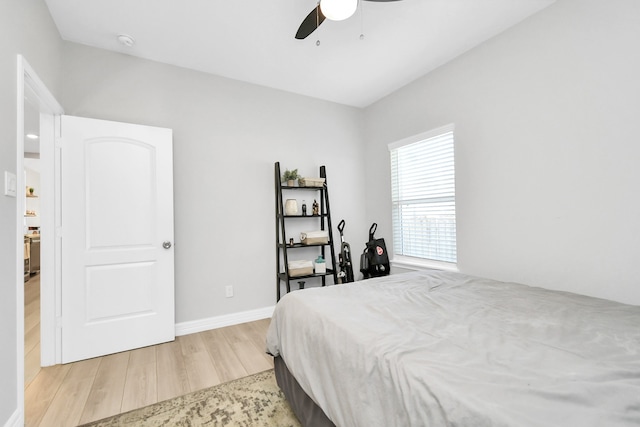 bedroom featuring light hardwood / wood-style flooring and ceiling fan