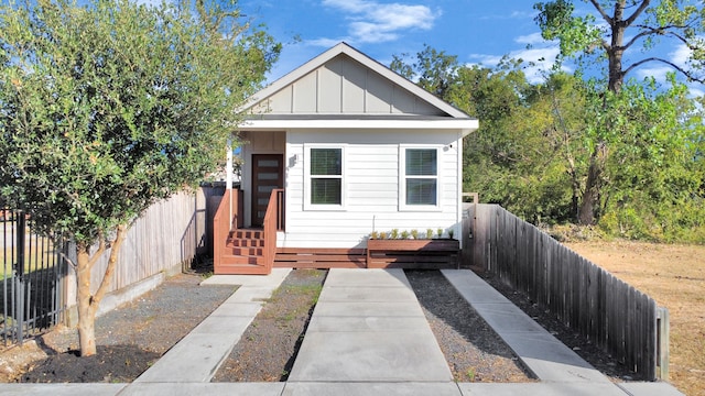 bungalow-style home with a deck