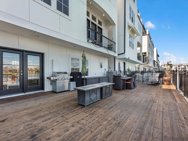 wooden terrace with area for grilling