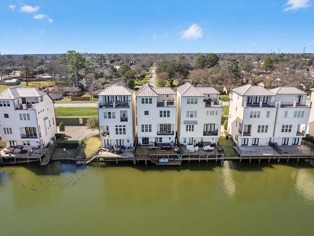 aerial view with a water view and a residential view