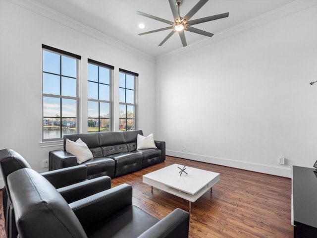 living area featuring recessed lighting, ornamental molding, ceiling fan, wood finished floors, and baseboards