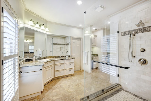 bathroom with crown molding, a shower with door, and vanity