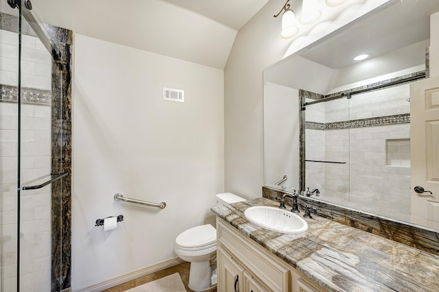 bathroom with lofted ceiling, vanity, toilet, and a shower with shower door