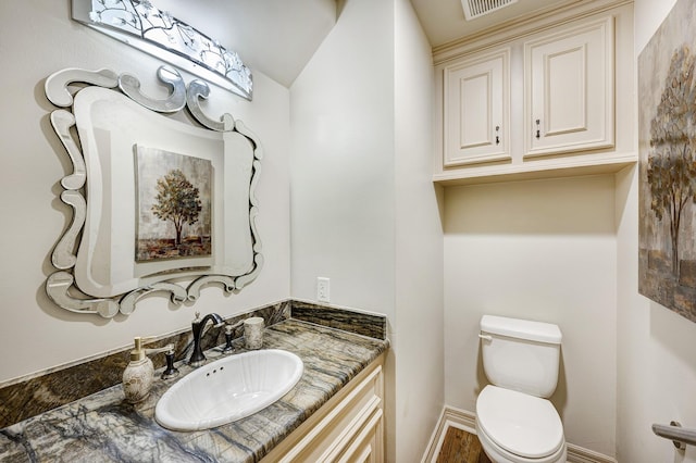 bathroom with vanity and toilet