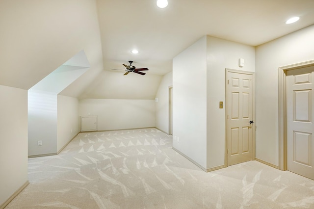 bonus room with light carpet, ceiling fan, and lofted ceiling