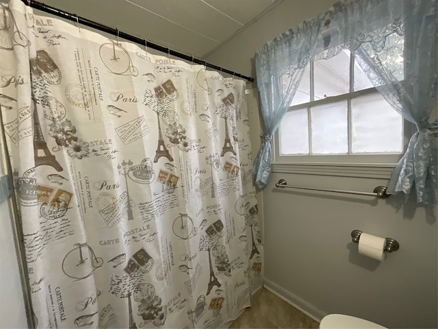 bathroom with curtained shower